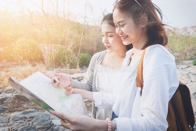 Woman traveler with backpack checks map to find Path is a goal. vintage tone. Woman traveler with backpack checks map to find Path is a goal. vintage tone stock photography Woman traveler with backpack checks map to find Path is a goal. vintage tone. Woman traveler with backpack checks map to find Path is a goal. vintage tone stock photography