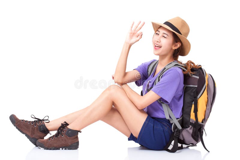 Woman traveler sitting on the floor and showing ok sign stock images Woman traveler sitting on the floor and showing ok sign stock images