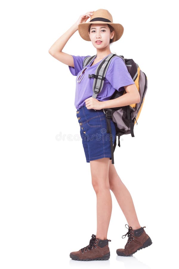 Woman traveler standing on the floor with backpack on white background. Female traveler standing stock images, royalty-free photos and pictures