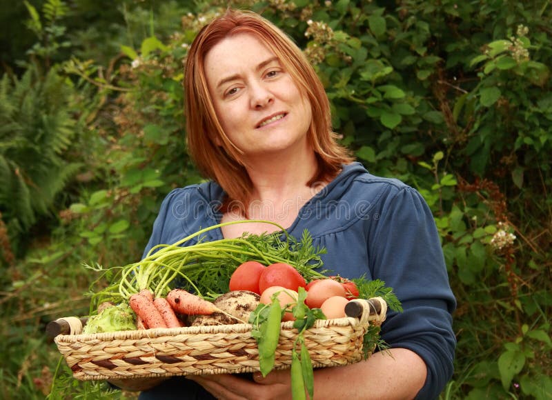 Woman with tray of vegetables