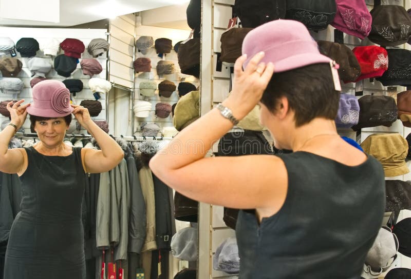 Woman trying on hat