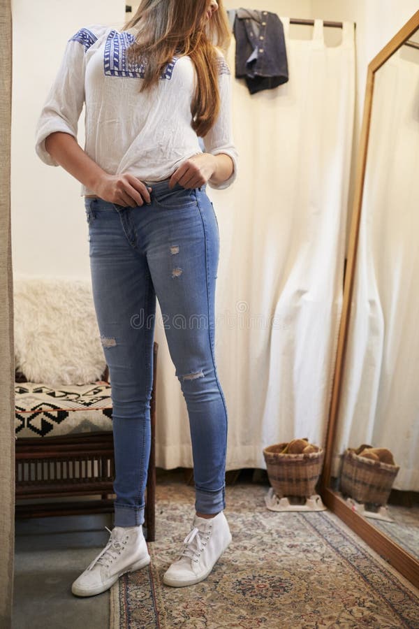 Trying jeans 4 stock image. Image of background, casual 2156547