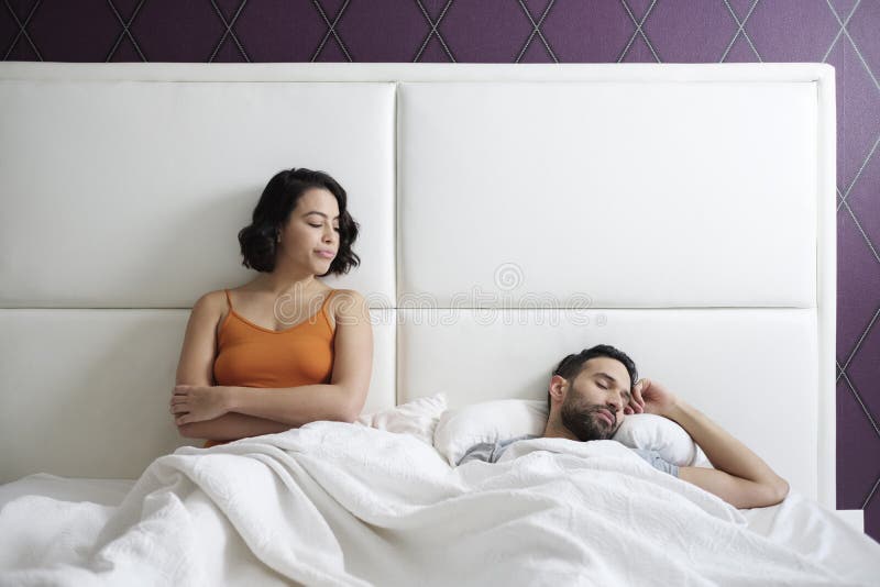 Woman Trying Sexual Approach with Man in Home Bed Stock Image hq nude photo