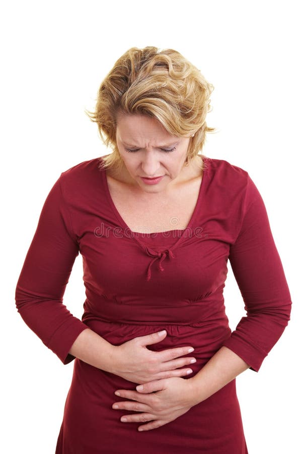 Woman holding her stomach with her hands. Spasm ache stock images, royalty-free photos and pictures