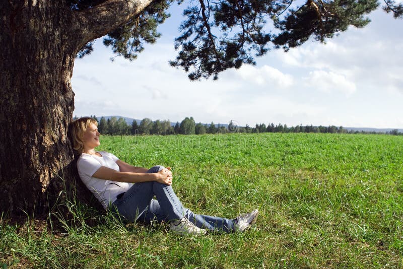 Woman under tree