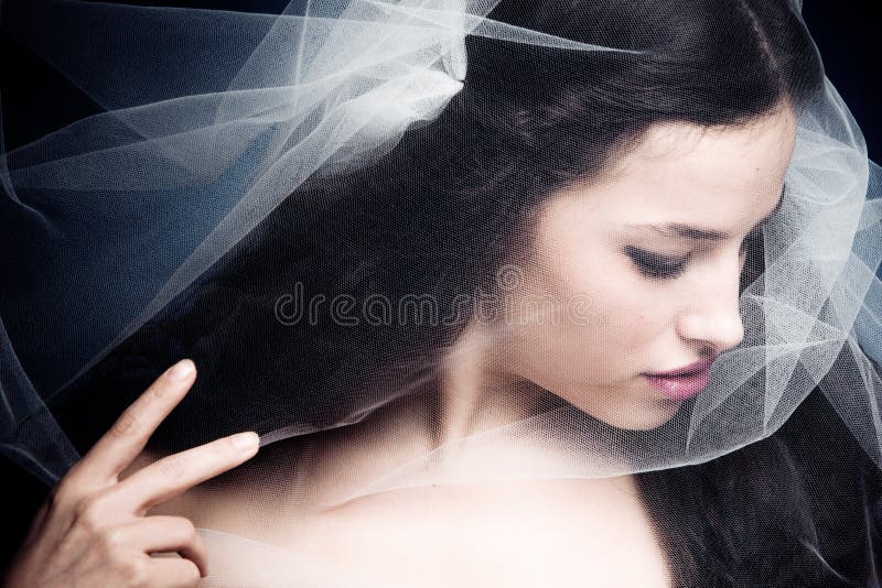 Woman under veil stock image
