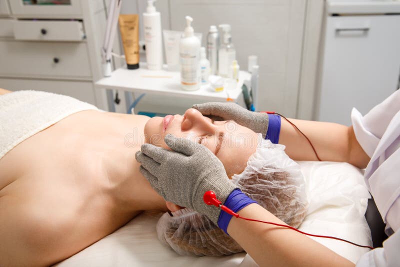 A Woman Undergoes A Facial Rejuvenation Procedure In A Cosmetology Clinic Getting Facial Hydro