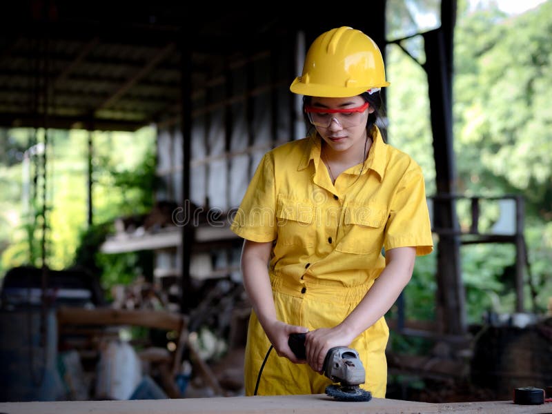 A Woman in a Uniform Working in a Technician is Preparing To Use the