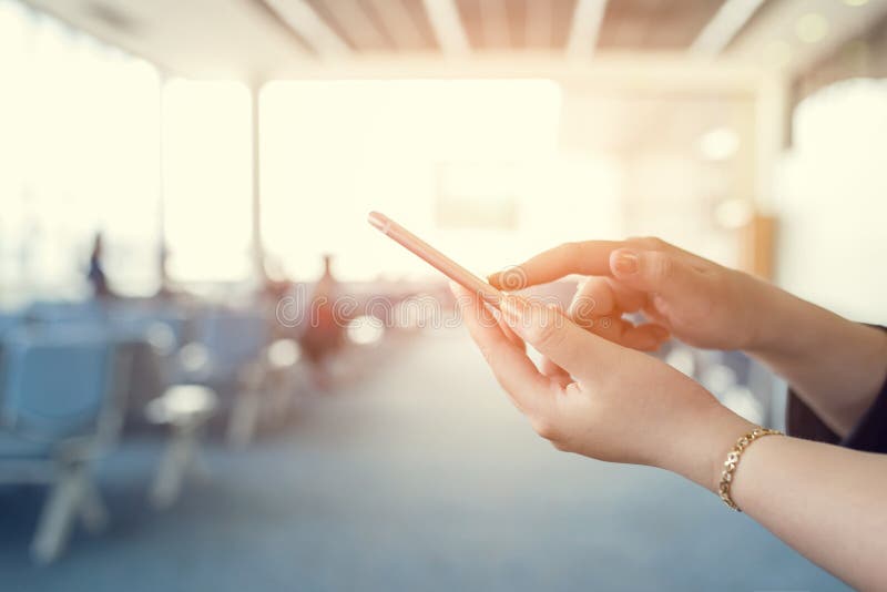 Woman use of cellphone inside waiting room