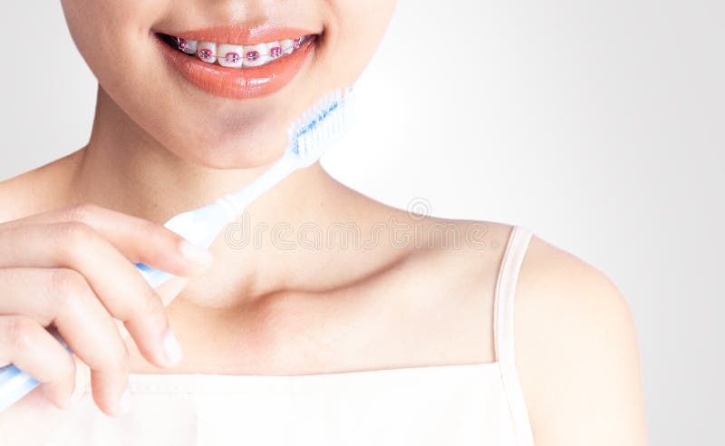 A woman is using a cleaning teeth royalty free stock photo