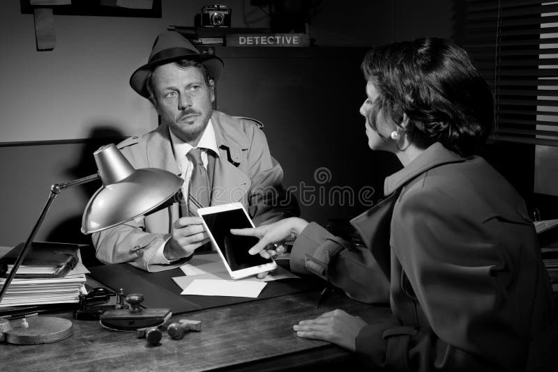 Woman using detective tablet at police department