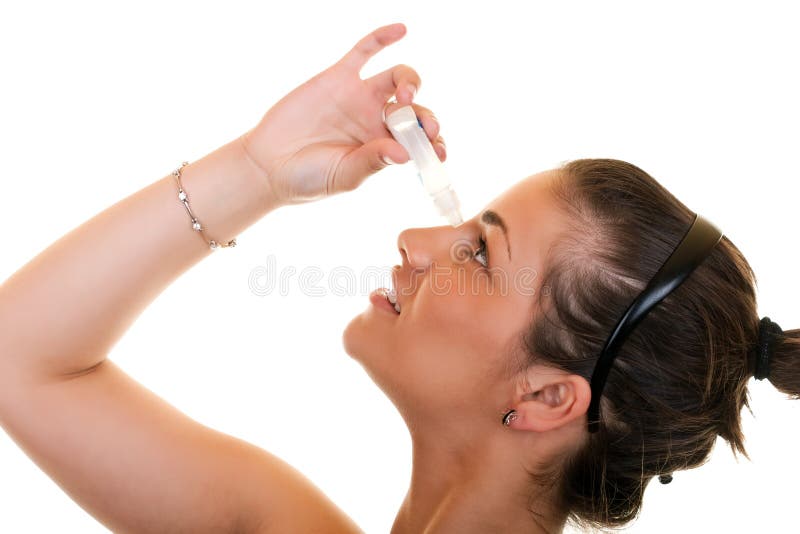 Woman using eye drops