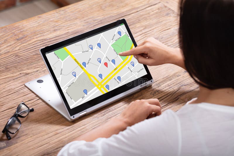 Woman Using GPS Navigation Map On Digital Laptop stock photography