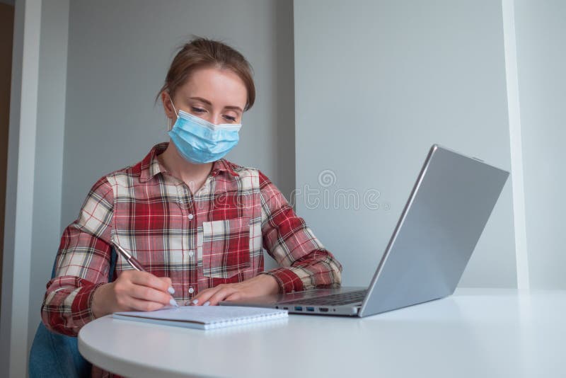 Woman Using Laptop Computer during Quarantine at Home Self Isolation