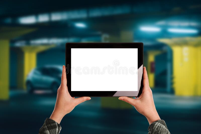 Woman using mobile application for car parking in underground ga stock photos