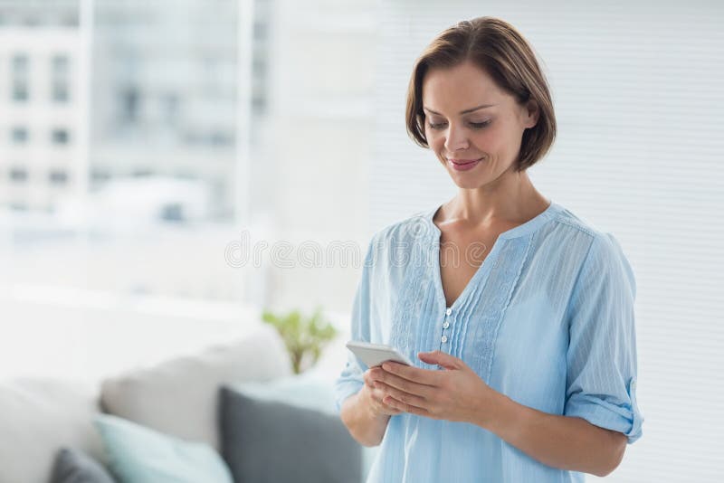 Woman using mobile phone stock image