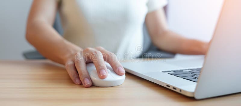 Woman Using Mouse and Laptop Computer during Working Long Time on