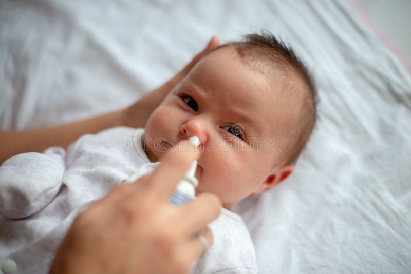 Woman Using Nasal Spray for Baby Stock Image Image of cleaning