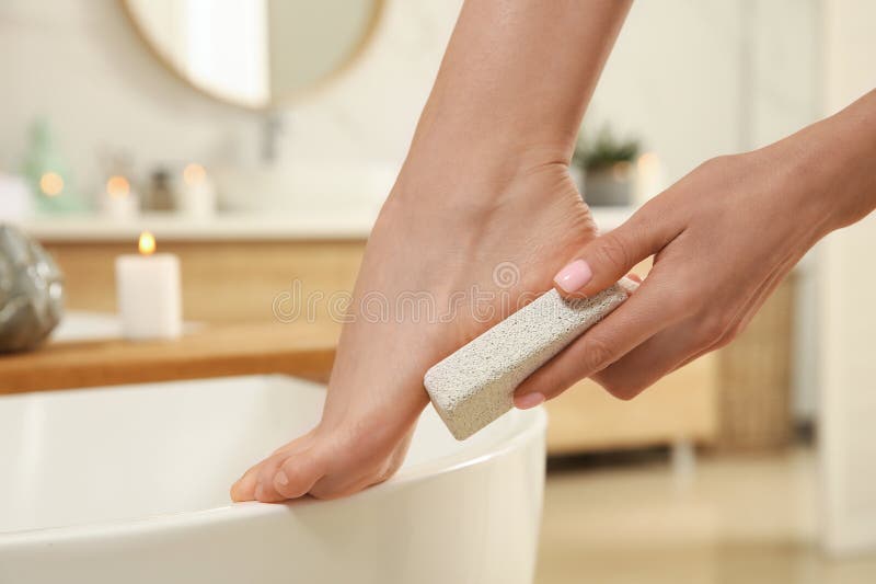 Woman Using Pumice Stone for Removing Dead Skin from Feet in Bathroom,  Closeup Stock Image - Image of hand, abrasive: 241098769