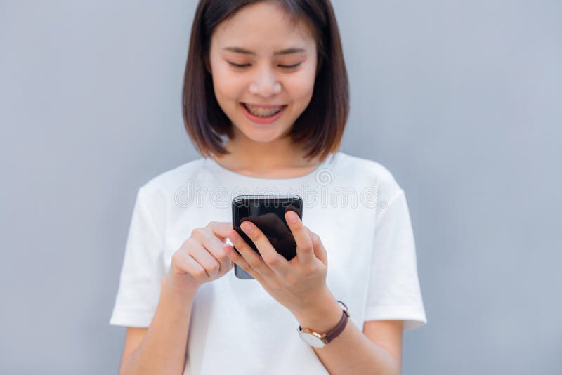 Woman using smartphone, During leisure time. The concept of using the phone. stock photo Woman using smartphone, During leisure time. The concept of using the phone. stock photo