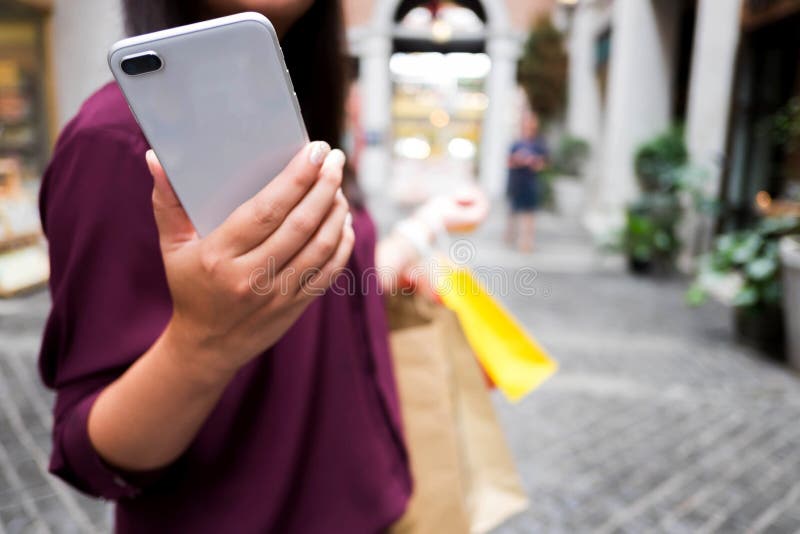 Woman using smartphone for shopping online, shopping concept.
