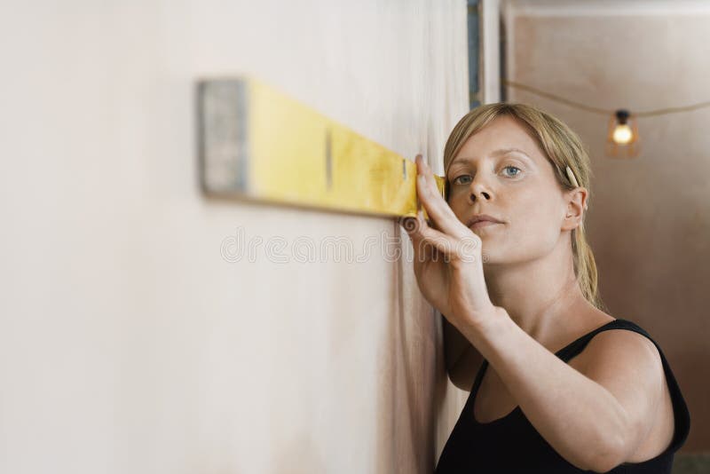 Woman Using Spirit Level