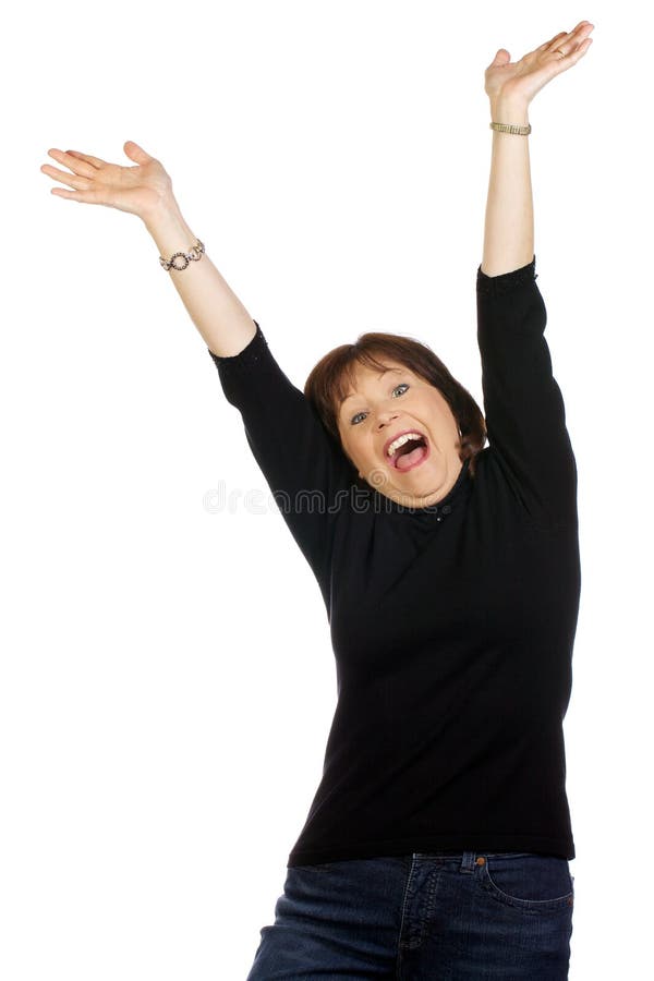 Woman in victorious expression. Middle aged confident woman expressing a joyous and victorious moment with arms raised in the air royalty free stock photos Woman in victorious expression. Middle aged confident woman expressing a joyous and victorious moment with arms raised in the air royalty free stock photos
