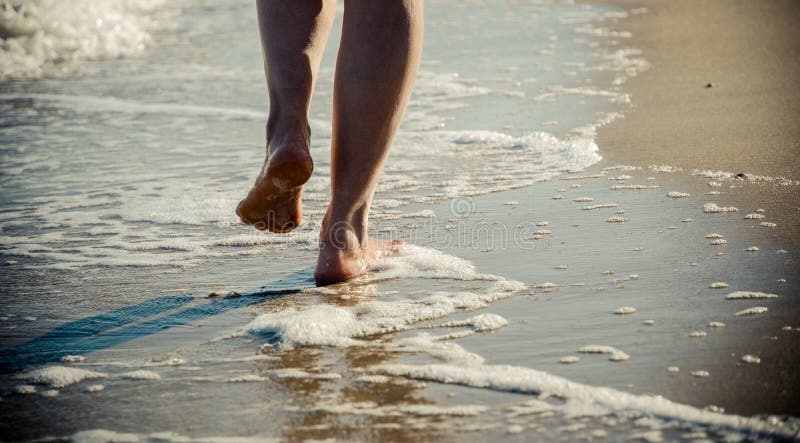 Woman on a walk on the beach in Los Angeles, California