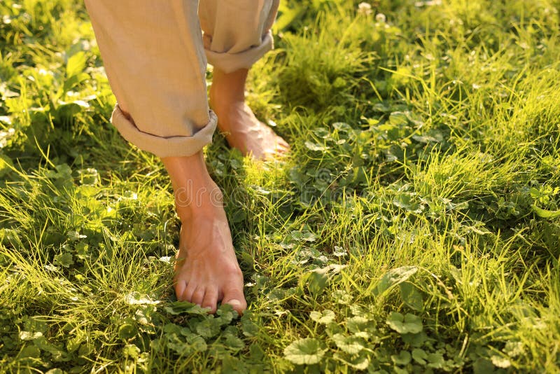 Woman Walking Barefoot on Green Grass Outdoors, Closeup. Space for Text ...