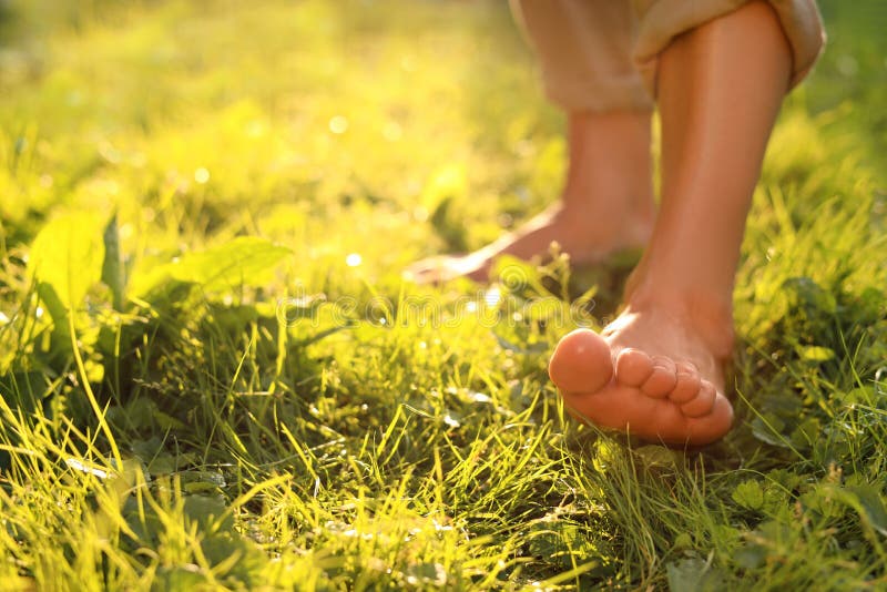 Woman Walking Barefoot on Green Grass Outdoors, Closeup. Space for Text ...