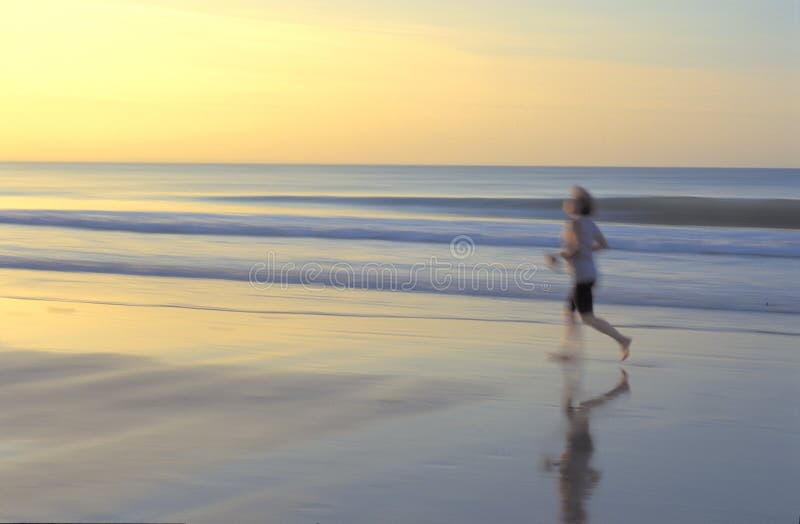 A woman walking on a beach