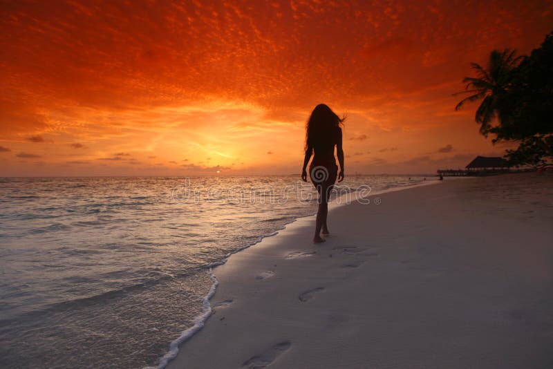 Woman walking on beach