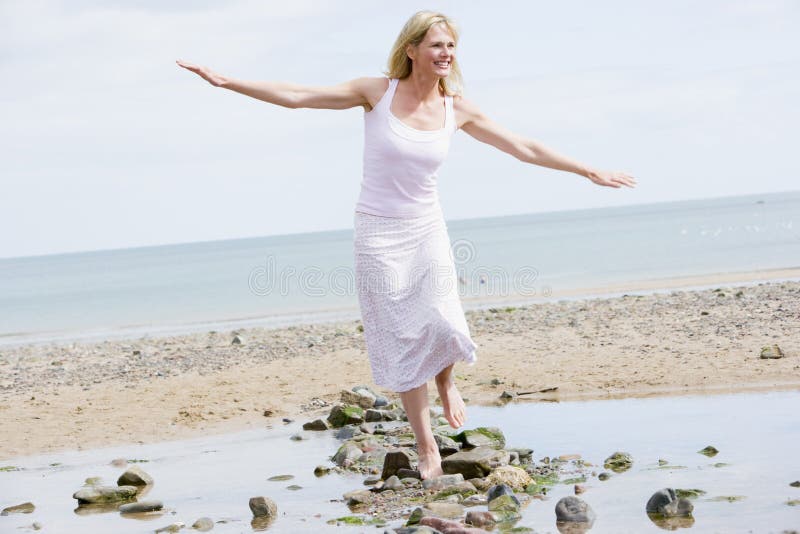 Woman walking on beach