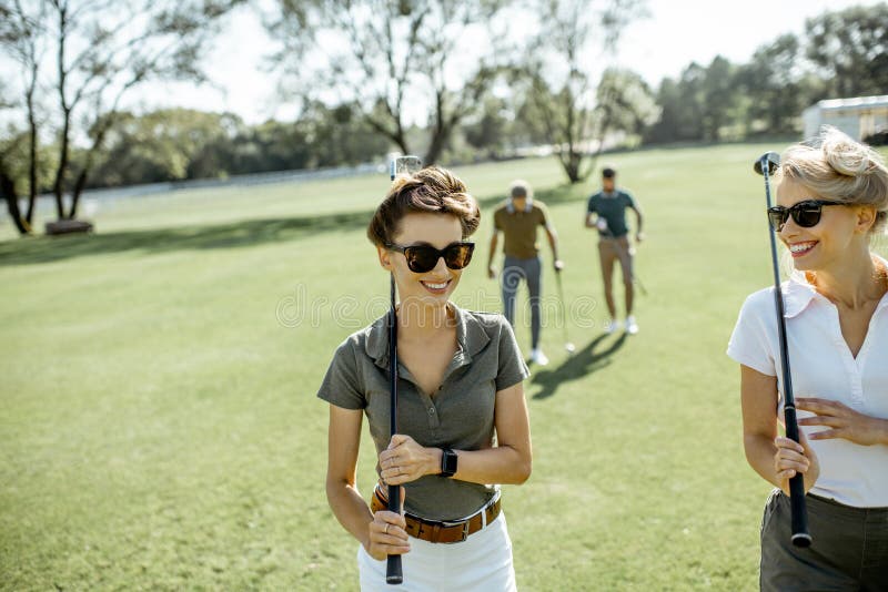 Woman walking on a golf course stock photos Woman walking on a golf course stock photos