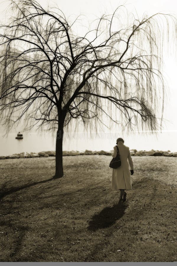Woman walking near tree