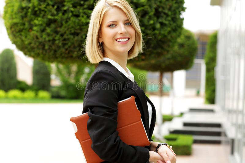 Happy beautiful woman walking outdoors