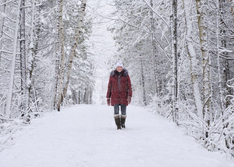 Woman Walking on Forest Trail in Snowstorm Stock Image - Image of ...