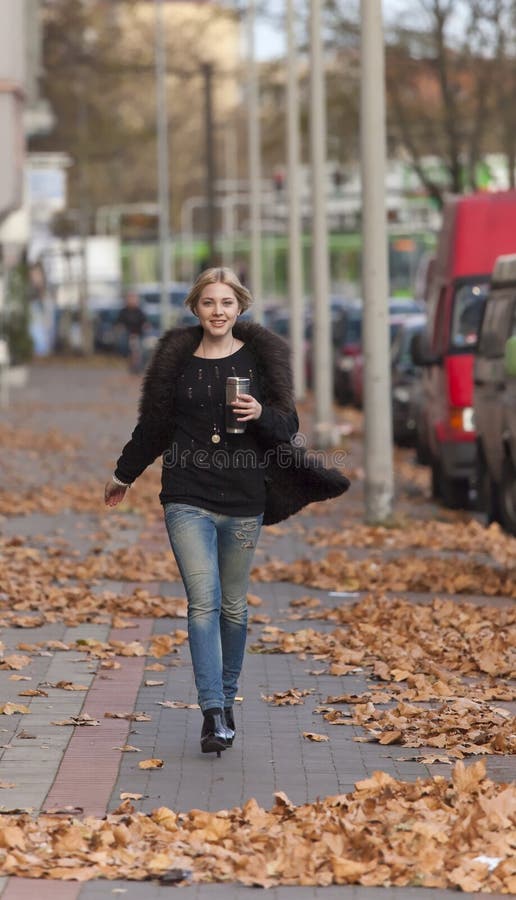 Ladylike candid with nice legs walking in the street