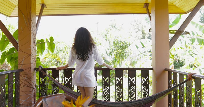 Woman Walking Terrace Looking At Tropical Forest Landscape In Morning Back Rear View Of Attractive Brunette Girl In Man