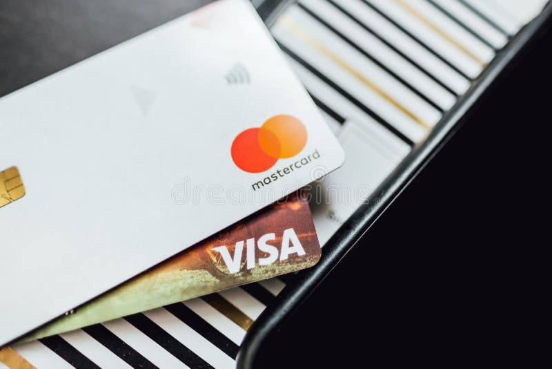 Woman warms up hands over heater. Concept of the need for good central heating.