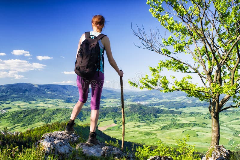 Woman watching from top of the hill, Slovakia