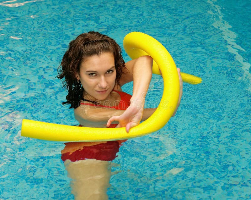 Woman is water with aqua noodles