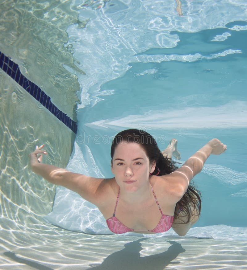 Woman Wearing A Bikini Swimsuit Holding Her Breathe Underwater Stock