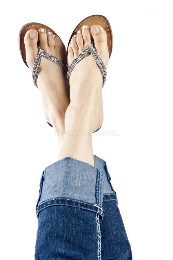 Woman Wearing Blue Jeans and Stylish Flip Flops