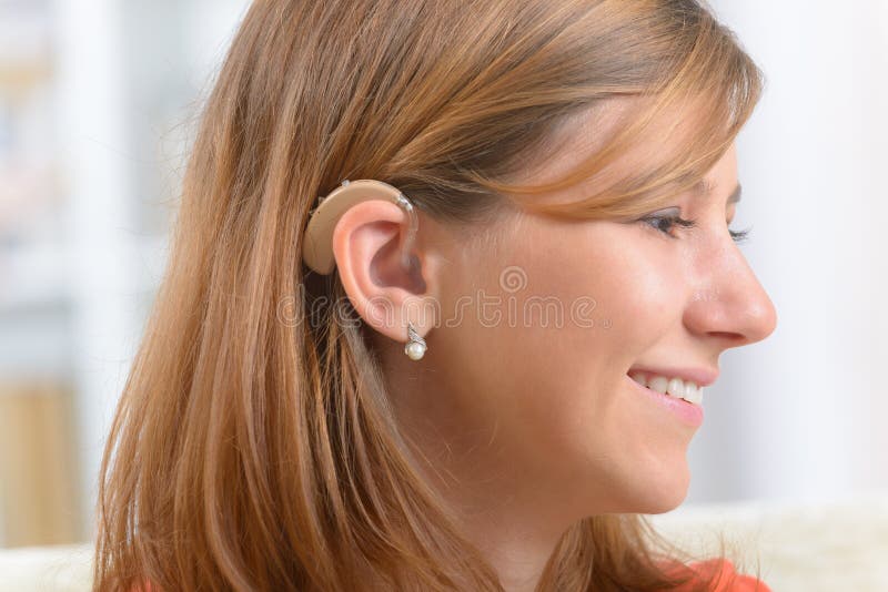 Woman wearing deaf aid