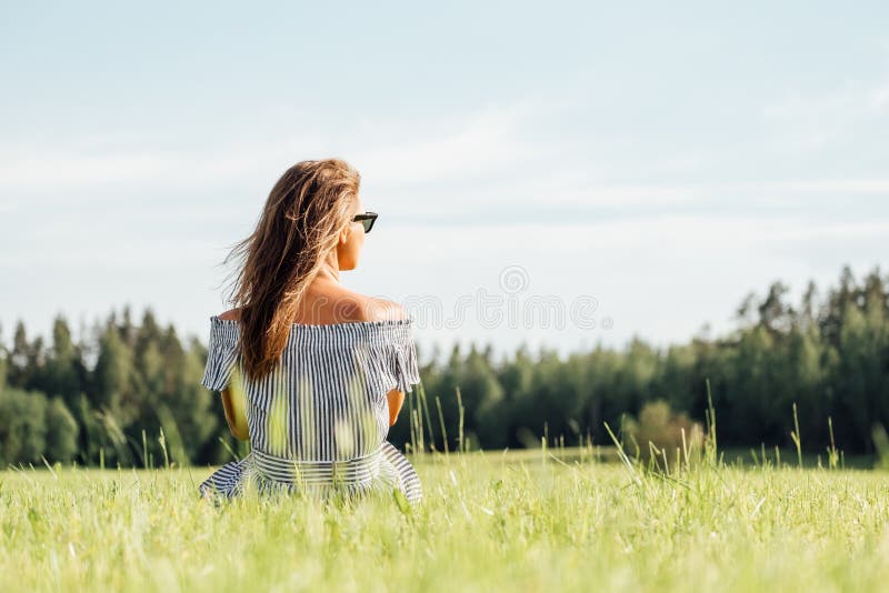 Woman Wearing Dress Sitting On Green Grass Field Stock Image Image Of Casual European 164551131 