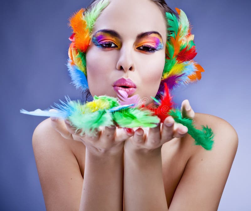 Woman wearing feather headdress