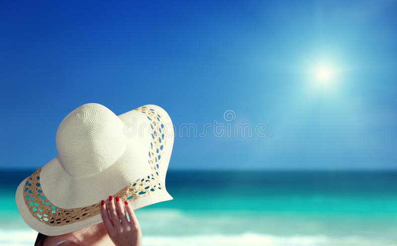 Woman wearing hat and beach