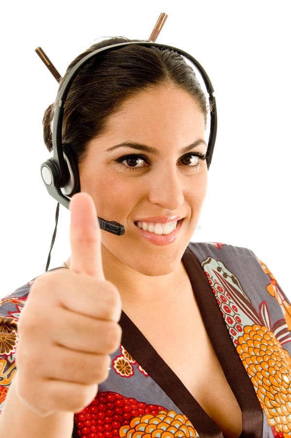 Woman wearing headset and showing thumbs up