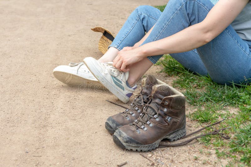 Woman Changing Her Shoes, Removing Her Normal Shoes and Putting on Her ...